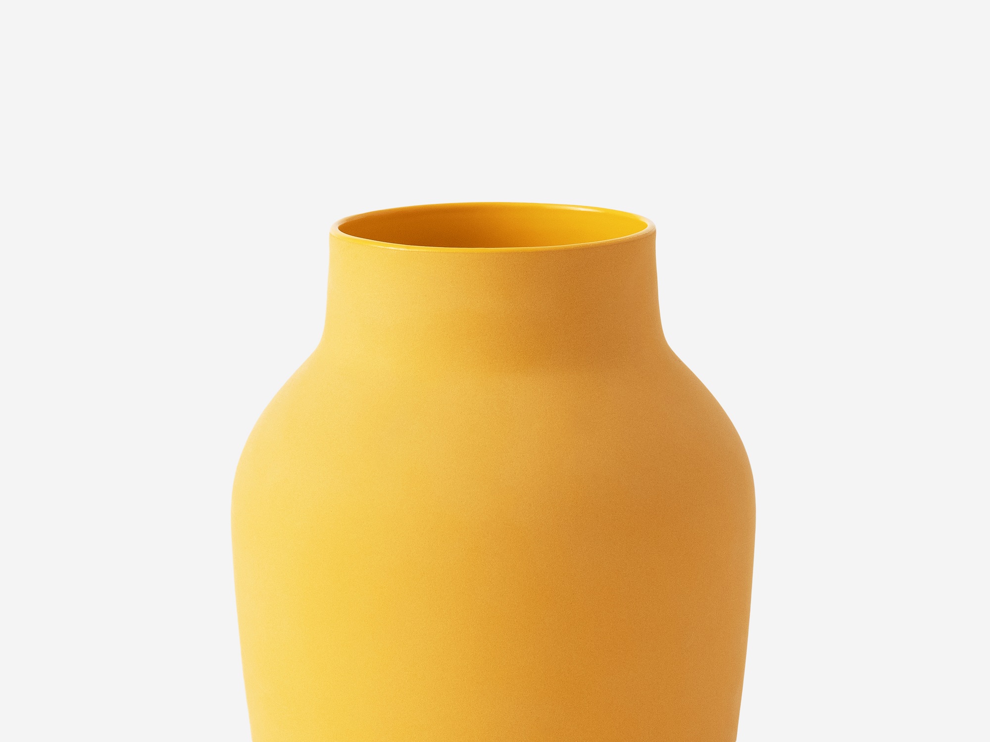 Detail view of medium yellow ceramic vase